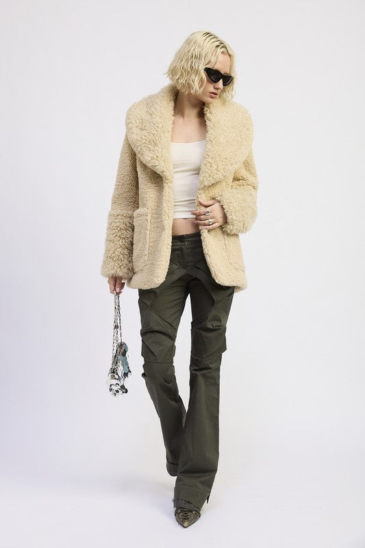 Full-length outfit featuring faux shearling teddy coat styled with cargo pantS-AVAH