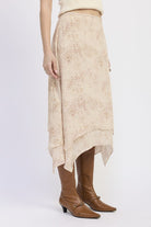 Side view of Wild Rose layered midi skirt with handkerchief hem and flowy layered design
