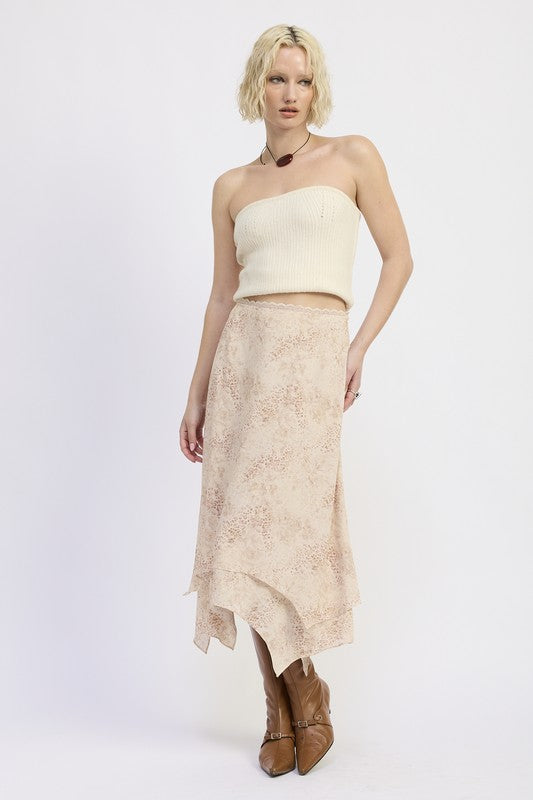 Model wearing Wild Rose layered midi skirt with soft leopard and rose print, paired with knit tube top and tall brown boots