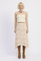 Model wearing Wild Rose layered midi skirt with soft leopard and rose print, paired with knit tube top and tall brown boots-AVAH