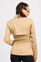 Back view of camel sculpted blazer with panel detailing and tailored fit.