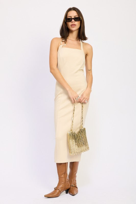 Taupe fitted midi dress with back slit, styled with brown boots and gold bag-AVAH