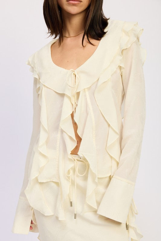 Chic cream ruffle blouse with flowing sleeves and tie cuffs