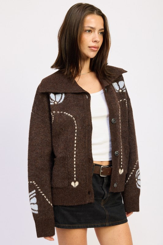 Side view of chocolate brown floral intarsia cardigan with collar, button front, and relaxed fit-AVAH