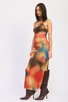 Three-quarter side view showing side slit on multicolor one-shoulder maxi dress

