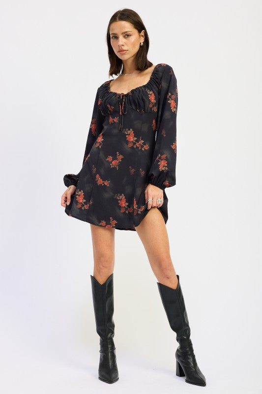 full front view of black mini dress with long sleeves and red floral print
