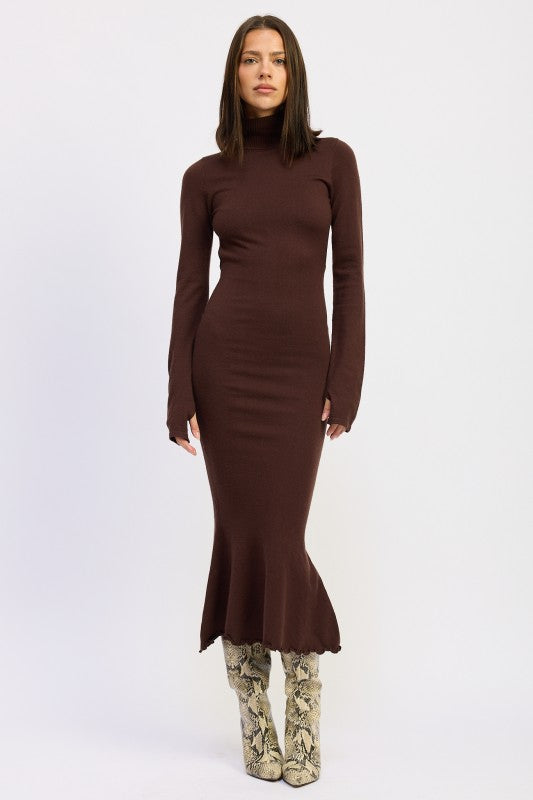 Model wearing the Sienna Whisper Open-Back Knit Dress in cocoa brown, long sleeves, turtleneck, and mermaid hem.