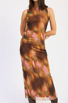 Close-up of rust mixed color abstract print maxi dress showing soft ruching and smooth sleeveless fit.
