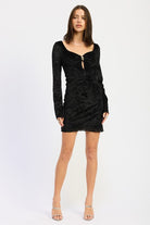 Front view of black keyhole mini dress with fitted silhouette and flared sleeves.
