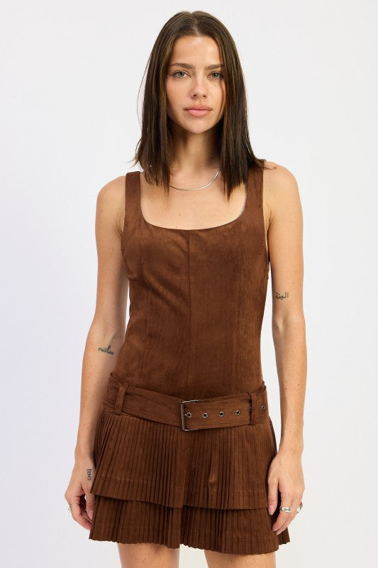 model wearing brown suede pleated mini dress with belt detail-AVAH