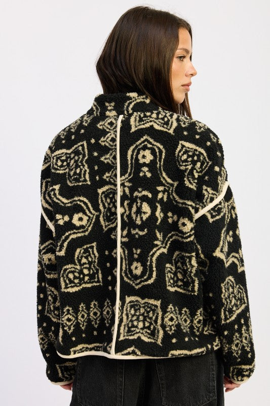 Back view of printed sherpa jacket showing bold motif and structured seams.
