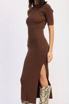 Side view of brown ribbed bodycon dress with side slit detail.
