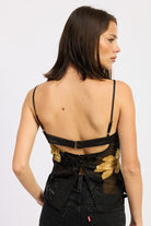 back view showing open-back hook closure and floral mesh texture