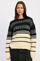 Black and cream Fair Isle crewneck sweater on model facing forward