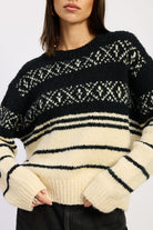 Close-up of black and cream Fair Isle sweater showing knit texture
