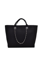 Black canvas tote with zip top closure, chain shoulder strap, and silver hardware