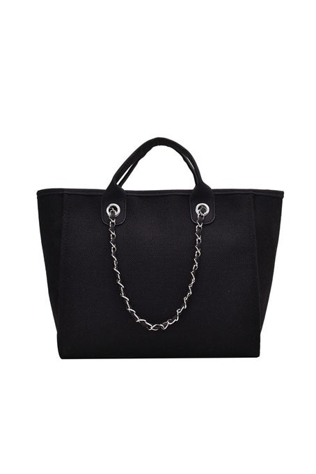 Black canvas tote with zip top closure, chain shoulder strap, and silver hardware