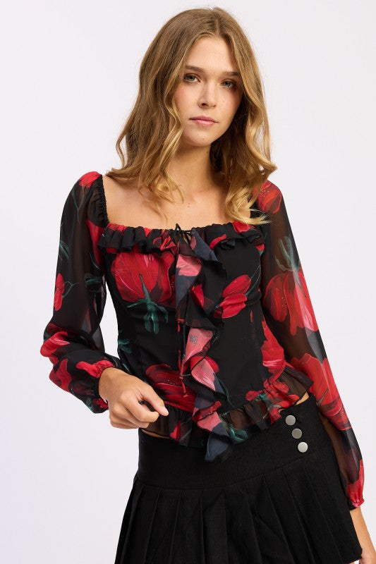 Model wearing a long-sleeve floral ruffle blouse with square neckline and sheer sleeves-AVAH