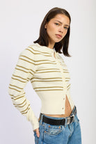Side view of ivory striped cardigan showing fitted ribbed hem

