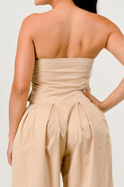 Rear bodice detail of strapless beige jumpsuit
