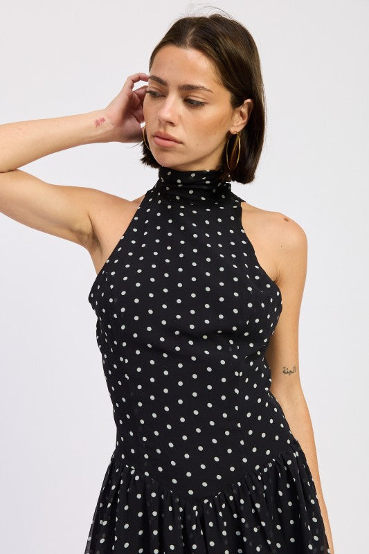 Black polka dot halter mini dress angled front view
