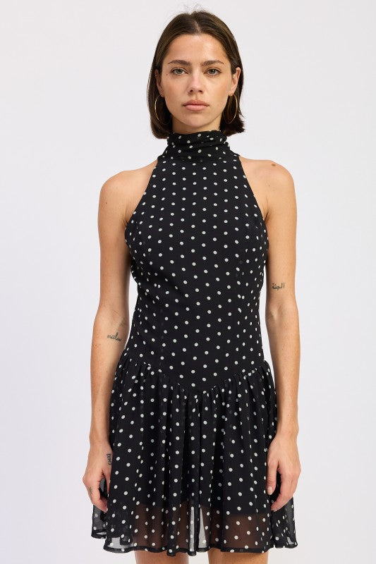 Black polka dot halter mini dress front view on model
