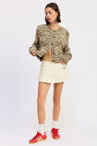 Full body front view of taupe brown knit sweater paired with cream skirt
