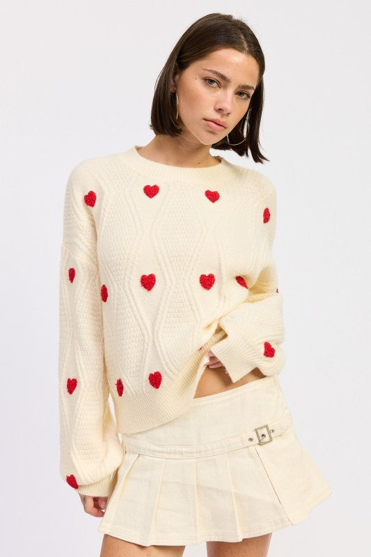 Ivory heart detail knit sweater with relaxed fit and long sleeves