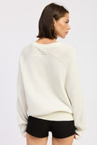 Back view of ivory cream cotton knit sweater with ribbed hem and cuffs