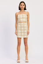 Full front view of cream crochet grid mini dress on model.
