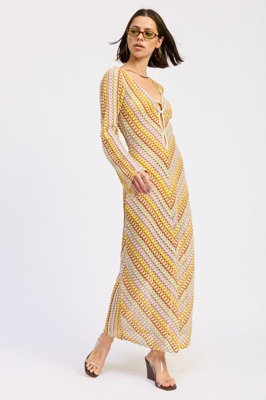 Angled front view of the Sunwoven Chevron Long Sleeve Maxi Dress highlighting the long sleeves, chevron knit pattern, and relaxed drape through the skirt.