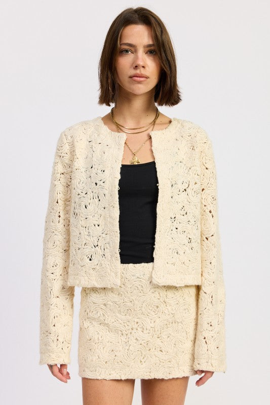 Front view of Ivory Reverie Textured Cropped Jacket in cream, featuring long sleeves and open front design-AVAH