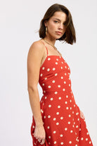 Close-up of straps and upper bodice of the red polka dot dress.