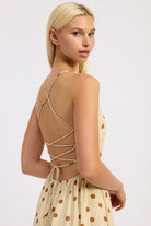 Butter cream version with lace-up open back detail.