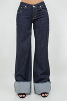 Close up of dark blue wide leg denim with contrast stitching