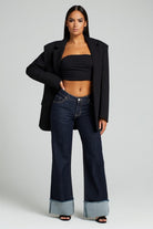 Dark wash wide leg jeans with oversized cuff hem front view