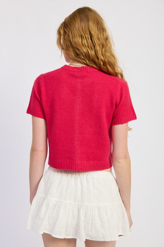 Back view of fuchsia cropped knit cardigan sweater