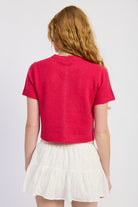 Back view of fuchsia cropped knit cardigan sweater