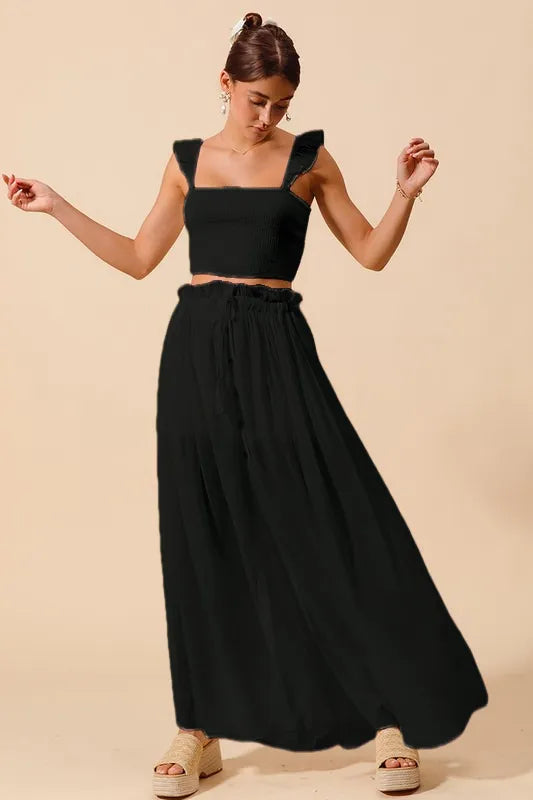Casual black maxi skirt set styled with platform sandals
