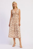 Ivory floral midi dress styled with heels.