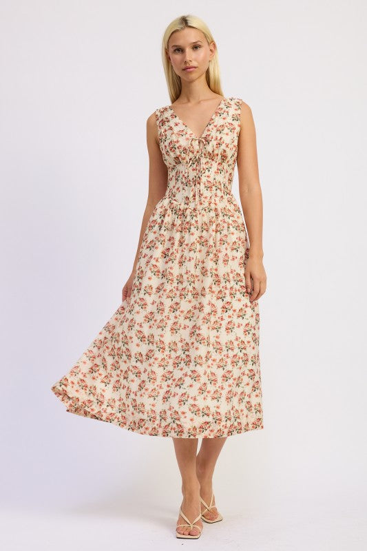 Full-length view of floral corset midi dress with flowing skirt
