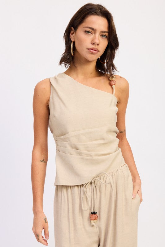 Beige one shoulder top with beaded strap detail