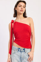 Front view of red one shoulder asymmetrical top with asymmetrical hem and ring detail

