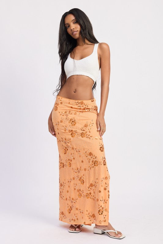 Orange beaded floral maxi skirt styled with white crop top, front view