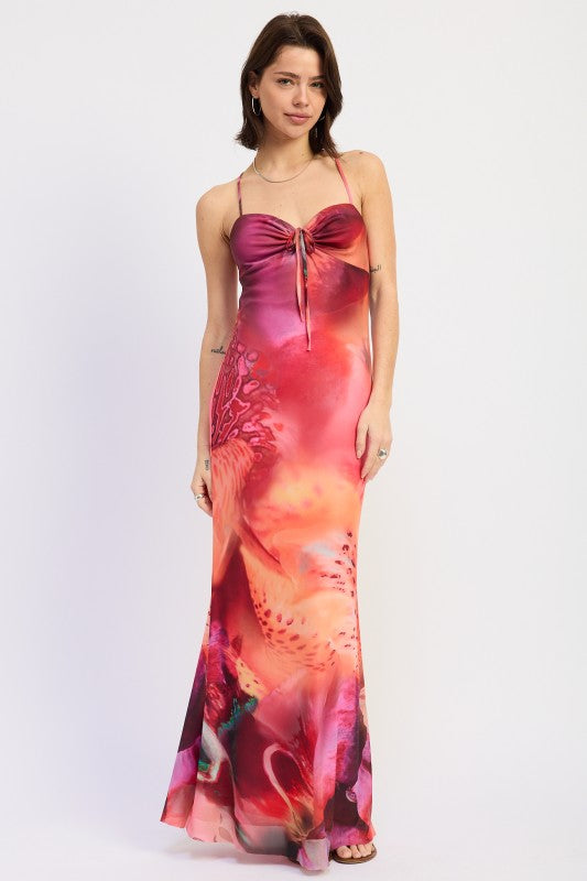 Model wearing sunset inspired floral print maxi dress with tie front neckline front view
