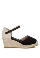Black wedge espadrille with woven heel detail and closed round toe – side view
