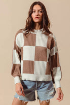 Coffee and ivory checkerboard knit sweater with crew neckline, long sleeves and ribbed trim, front view.