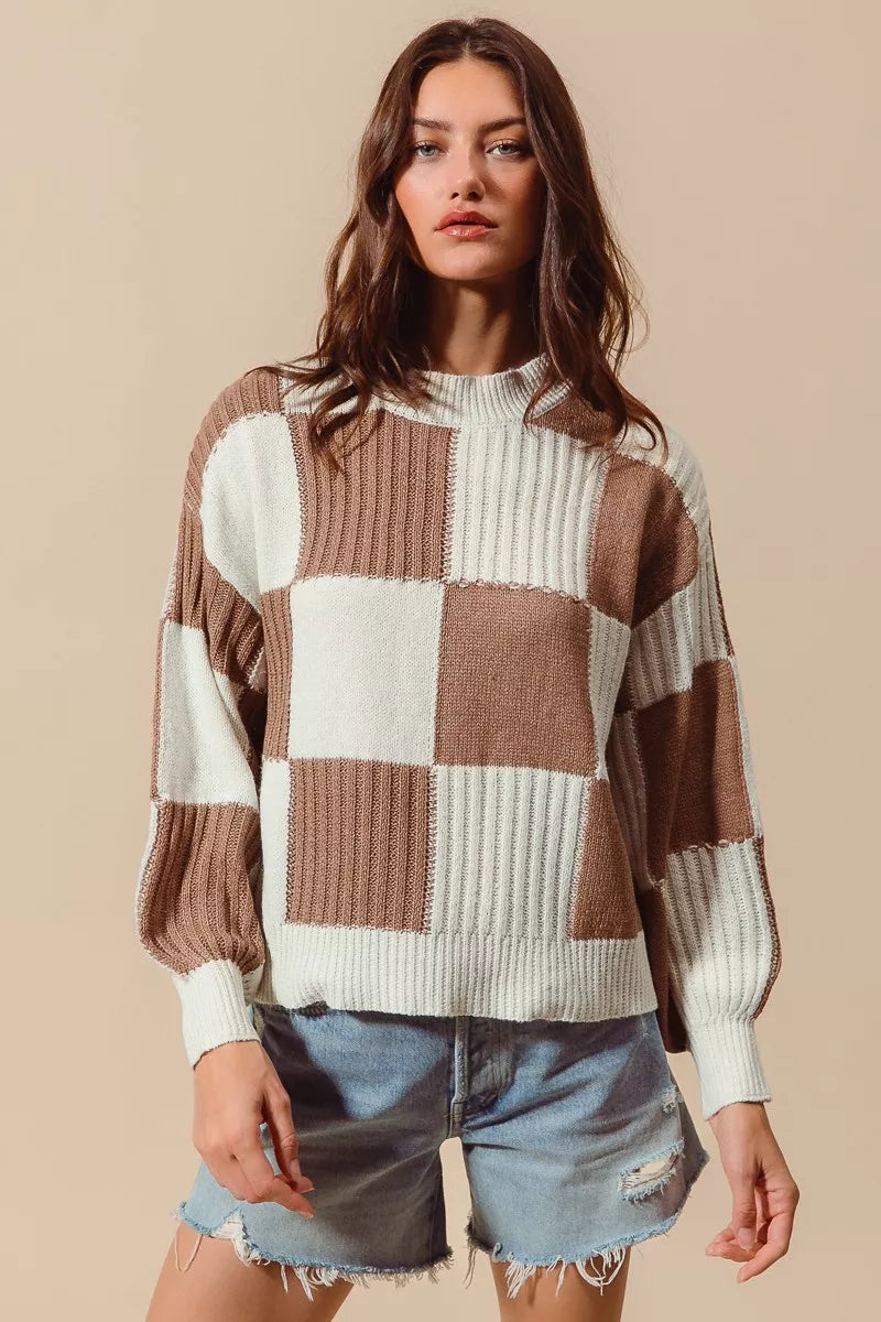 Coffee and ivory checkerboard knit sweater with crew neckline, long sleeves and ribbed trim, front view.