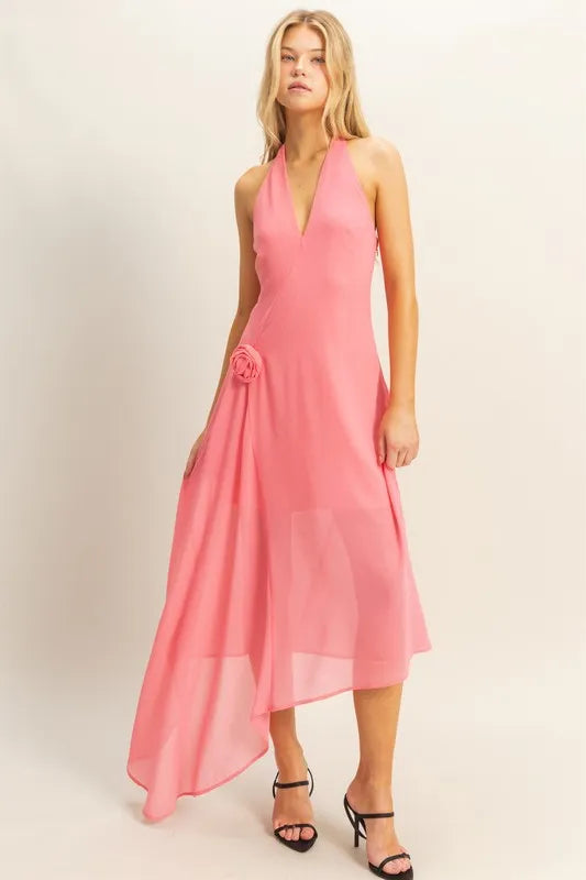 Pink asymmetrical chiffon midi dress with plunging halter neckline and draped rosette detail
