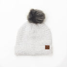 White boucle knit hat with faux fur pom 